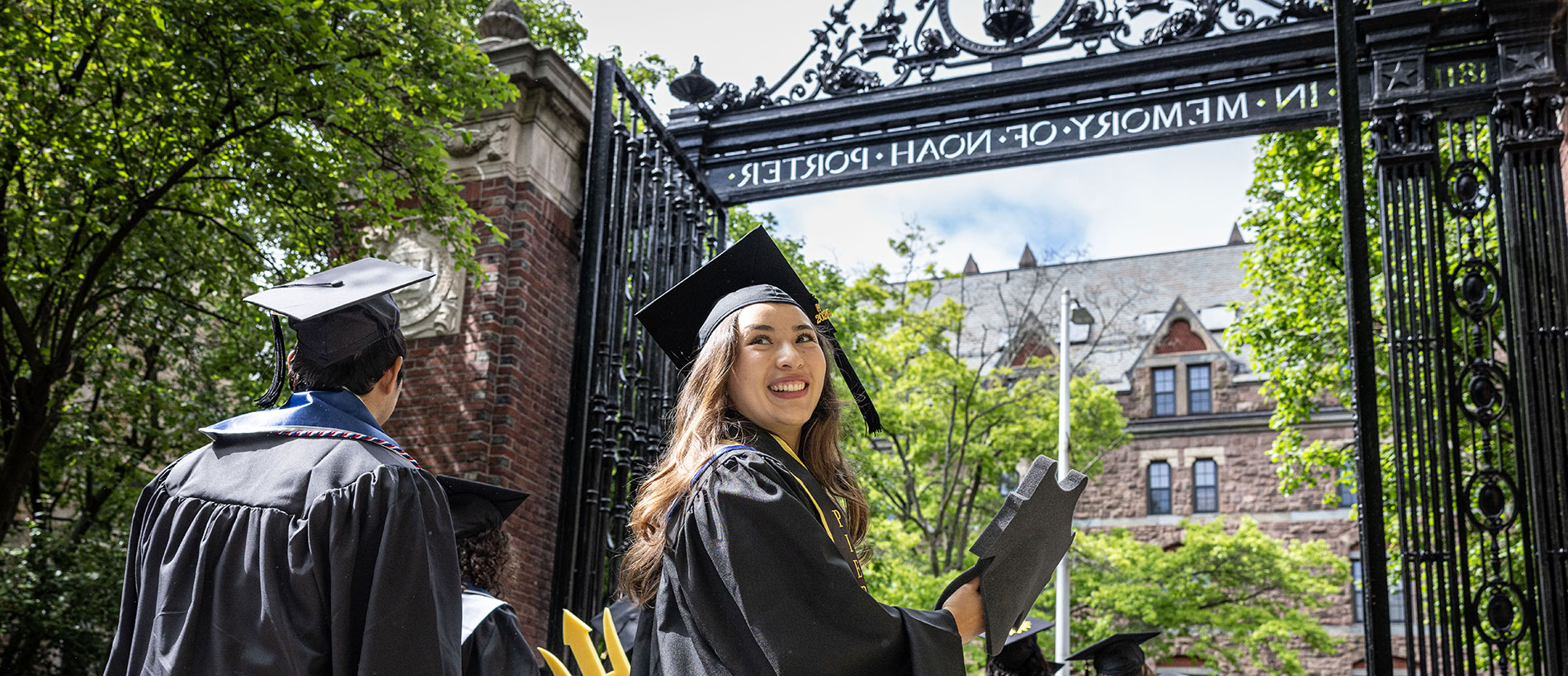 Yale student with cap and gown walking in procession