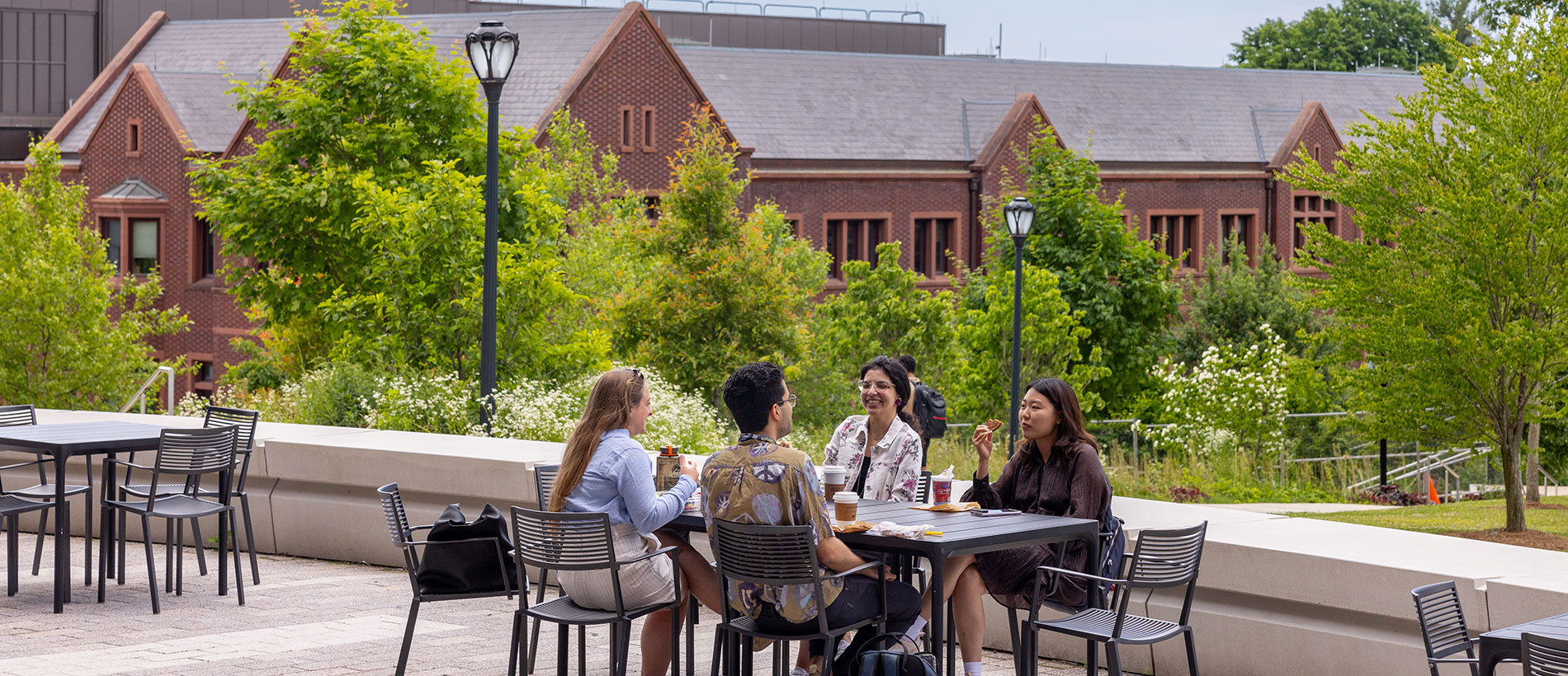 students sitting at an outdoor table